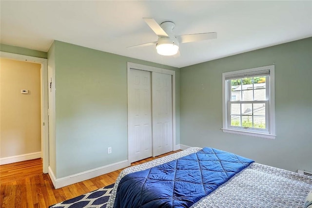 15 Lafayette Rd, Barrington, RI 02806 - bedroom with a closet, baseboards, wood finished floors, and a ceiling fan