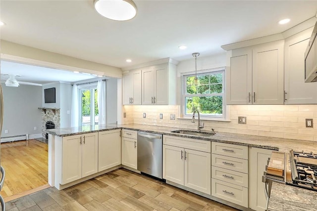 15 Lafayette Rd, Barrington, RI 02806 - kitchen with appliances with stainless steel finishes, a sink, a peninsula, plenty of natural light, and recessed lighting