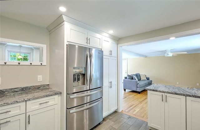 15 Lafayette Rd, Barrington, RI 02806 - kitchen featuring stainless steel fridge with ice dispenser, light wood finished floors, white cabinets, light stone counters, and recessed lighting