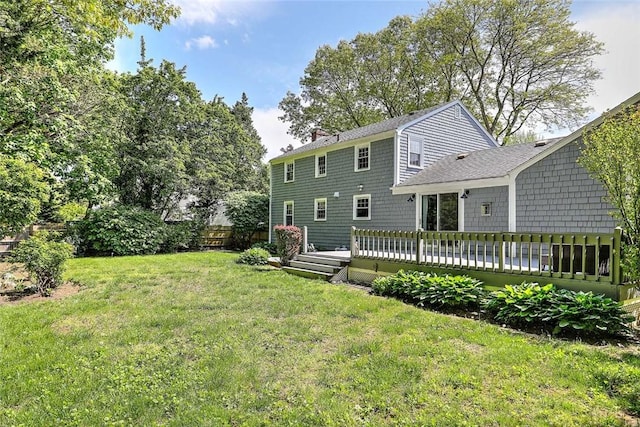 15 Lafayette Rd, Barrington, RI 02806 - rear view of property featuring a lawn, a chimney, and a wooden deck