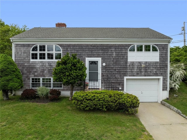 3 Ernest St, Newport, RI 02840 - view of front facade featuring a front yard, a chimney, a garage, concrete driveway, and a shingled roof