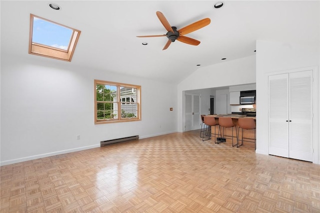 3 Ernest St, Newport, RI 02840 - living area featuring lofted ceiling, a baseboard heating unit, a ceiling fan, a skylight, and baseboards
