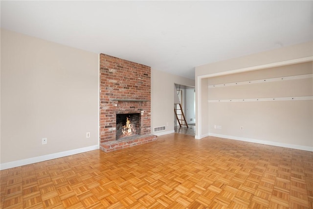 3 Ernest St, Newport, RI 02840 - unfurnished living room with baseboards and a brick fireplace