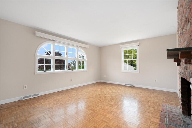 3 Ernest St, Newport, RI 02840 - unfurnished living room with baseboards and a fireplace