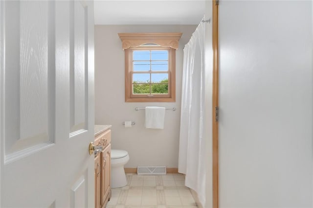 3 Ernest St, Newport, RI 02840 - bathroom with toilet, vanity, a shower with curtain, tile patterned floors, and baseboards