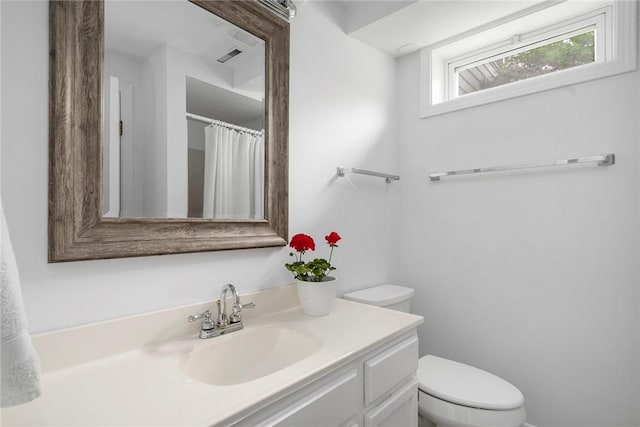 3 Ernest St, Newport, RI 02840 - bathroom featuring toilet, vanity, and a shower with shower curtain