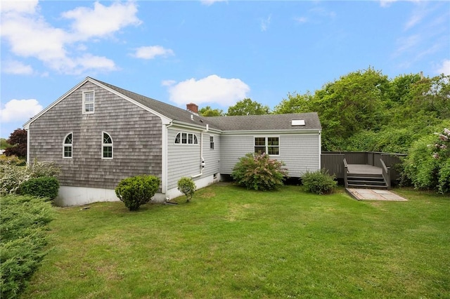 3 Ernest St, Newport, RI 02840 - rear view of house with a deck, a lawn, and a chimney