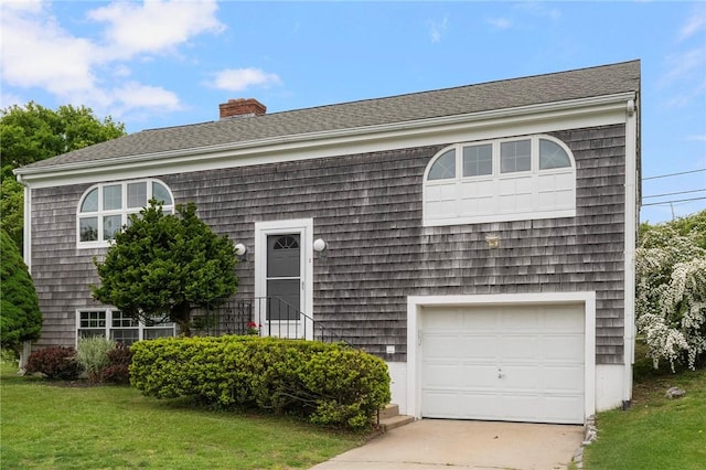3 Ernest St, Newport, RI 02840 - view of front of home featuring a chimney, a front yard, a garage, and driveway