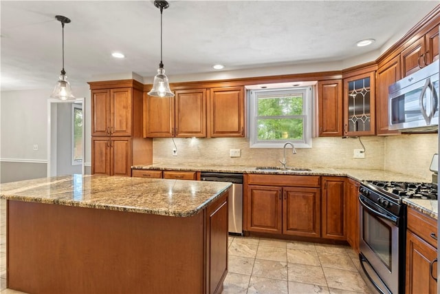 19 Bruce Dr, North Smithfield, RI 02896 - kitchen featuring a sink, stainless steel appliances, brown cabinets, tasteful backsplash, and recessed lighting
