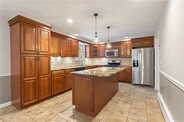 19 Bruce Dr, North Smithfield, RI 02896 - kitchen featuring stainless steel appliances, a sink, a baseboard heating unit, baseboards, and brown cabinetry
