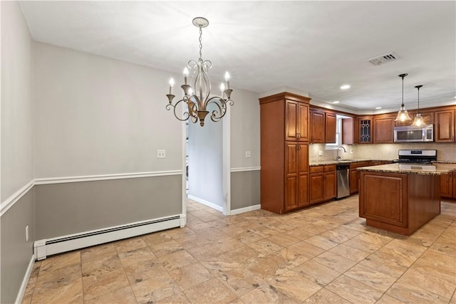 19 Bruce Dr, North Smithfield, RI 02896 - kitchen featuring appliances with stainless steel finishes, a baseboard heating unit, light stone countertops, baseboards, and brown cabinetry