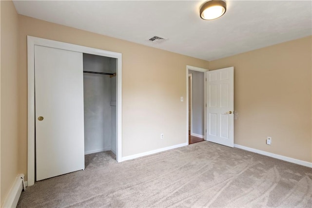 19 Bruce Dr, North Smithfield, RI 02896 - unfurnished bedroom featuring carpet flooring, a closet, baseboards, and a baseboard heating unit