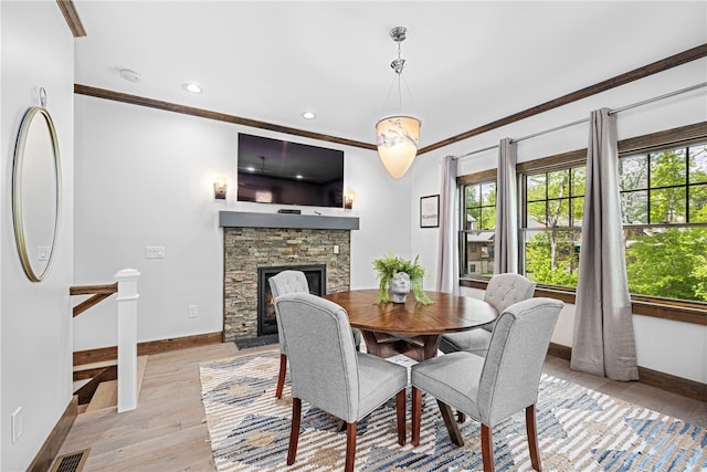 3 Gardenia Dr Unit M6, Richmond, RI 02898 - dining room with baseboards, light wood-style floors, ornamental molding, a fireplace, and recessed lighting