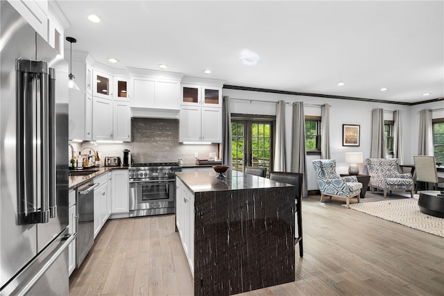 3 Gardenia Dr Unit M6, Richmond, RI 02898 - kitchen with high quality appliances, plenty of natural light, crown molding, light wood finished floors, and recessed lighting