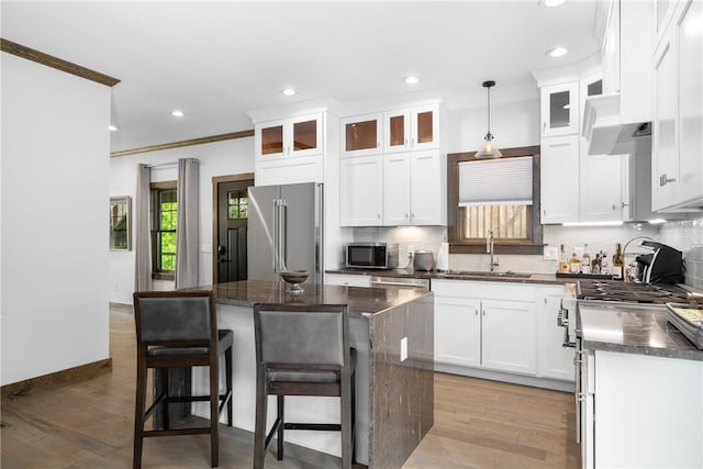 3 Gardenia Dr Unit M6, Richmond, RI 02898 - kitchen featuring a sink, high quality appliances, tasteful backsplash, recessed lighting, and white cabinetry