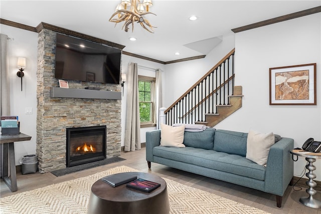 3 Gardenia Dr Unit M6, Richmond, RI 02898 - living room with ornamental molding, wood finished floors, stairway, a stone fireplace, and baseboards