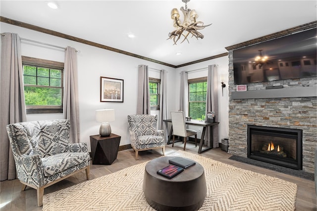 3 Gardenia Dr Unit M6, Richmond, RI 02898 - living area with wood finished floors, a stone fireplace, crown molding, baseboards, and recessed lighting