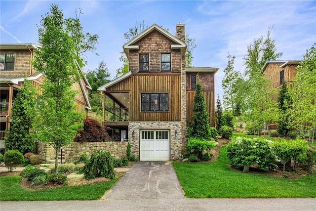 3 Gardenia Dr Unit M6, Richmond, RI 02898 - view of front of property with a garage, asphalt driveway, a chimney, a balcony, and a front lawn