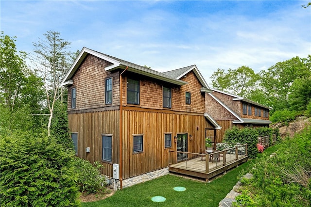 3 Gardenia Dr Unit M6, Richmond, RI 02898 - rear view of house with a wooden deck, a yard, and board and batten siding