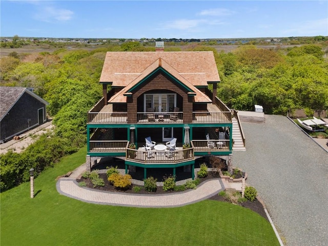 129 Sand Hill Cove Rd, Narragansett, RI 02882 - back of house featuring a balcony, a lawn, and a chimney