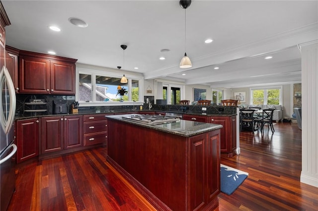 129 Sand Hill Cove Rd, Narragansett, RI 02882 - kitchen featuring reddish brown cabinets, a kitchen island, dark wood-style floors, recessed lighting, and beam ceiling