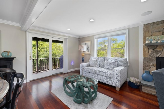 129 Sand Hill Cove Rd, Narragansett, RI 02882 - living area featuring plenty of natural light, ornamental molding, wood finished floors, baseboards, and a stone fireplace