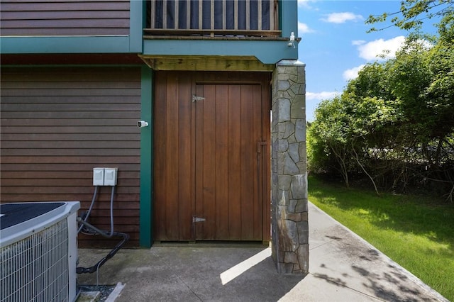 129 Sand Hill Cove Rd, Narragansett, RI 02882 - doorway to property featuring a balcony and cooling unit