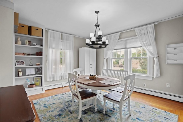 47 Cliff St, East Greenwich, RI 02818 - dining space with a chandelier, wood finished floors, and baseboard heating
