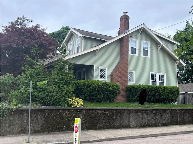47 Cliff St, East Greenwich, RI 02818 - view of home's exterior with a chimney