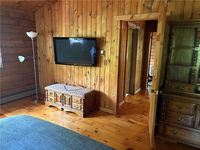 85 Plainfield Pike, Foster, RI 02825 - bedroom with wood walls, baseboard heating, and wood-type flooring