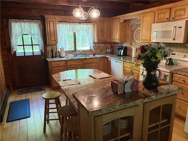 85 Plainfield Pike, Foster, RI 02825 - kitchen with white appliances, a sink, plenty of natural light, a kitchen island, and beamed ceiling