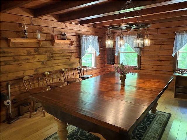 85 Plainfield Pike, Foster, RI 02825 - dining area featuring wood-type flooring, beamed ceiling, and wooden walls