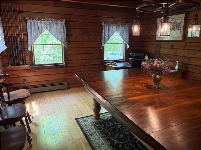 85 Plainfield Pike, Foster, RI 02825 - dining room with a baseboard heating unit, hardwood / wood-style floors, and wooden walls