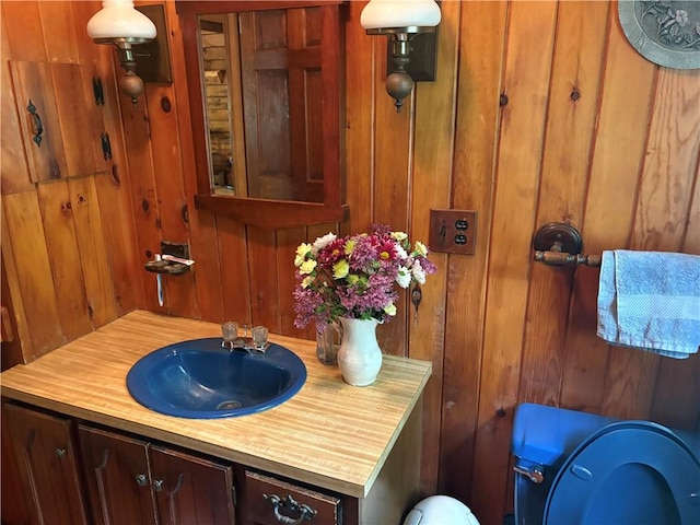 85 Plainfield Pike, Foster, RI 02825 - bathroom with vanity, toilet, and wooden walls