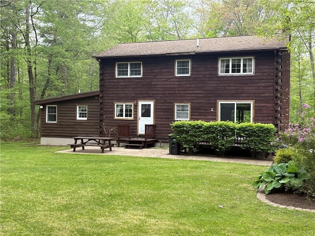85 Plainfield Pike, Foster, RI 02825 - back of property featuring a yard, a chimney, and a patio area