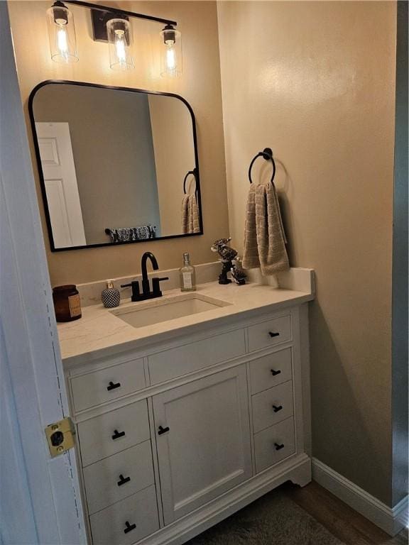 54 Polk Rd, Warwick, RI 02889 - bathroom with vanity and baseboards