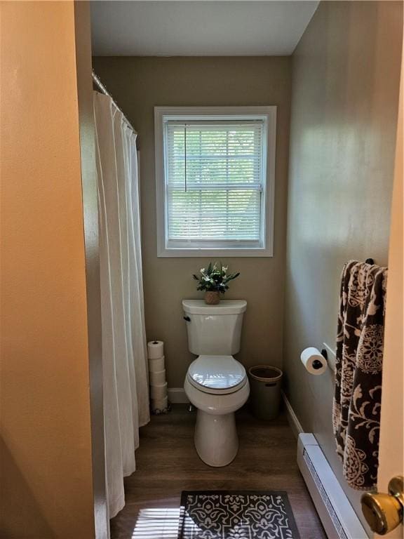 54 Polk Rd, Warwick, RI 02889 - full bath featuring toilet, wood finished floors, a baseboard heating unit, and baseboards