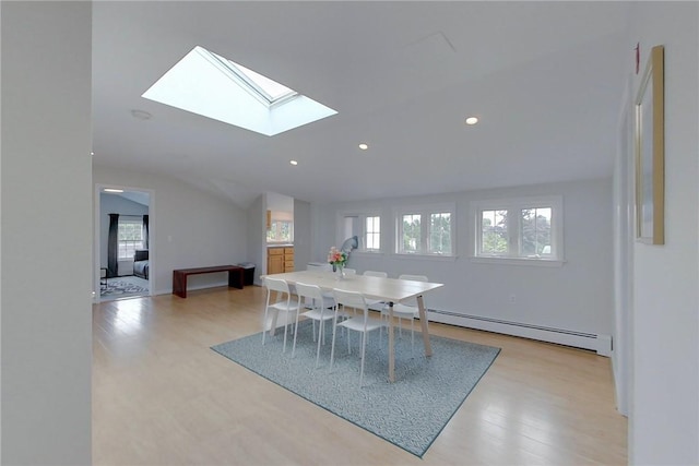26 Cliff Ave Unit 4, Newport, RI 02840 - dining room featuring a baseboard heating unit, vaulted ceiling, light wood-style floors, a skylight, and recessed lighting