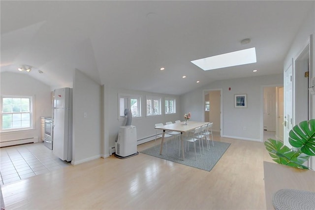 26 Cliff Ave Unit 4, Newport, RI 02840 - dining area featuring lofted ceiling, baseboard heating, a skylight, light wood finished floors, and recessed lighting