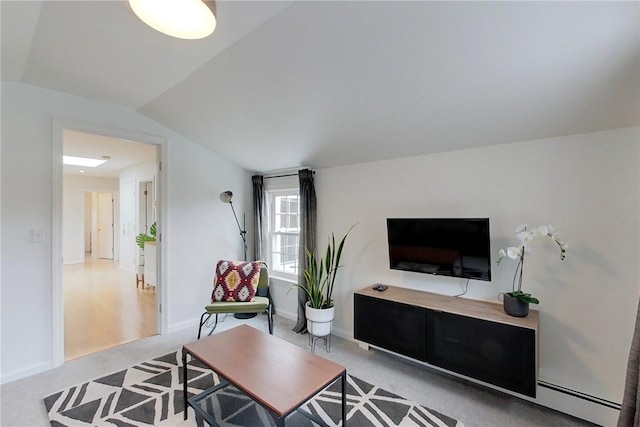 26 Cliff Ave Unit 4, Newport, RI 02840 - living area featuring a baseboard radiator, light carpet, vaulted ceiling, and baseboards