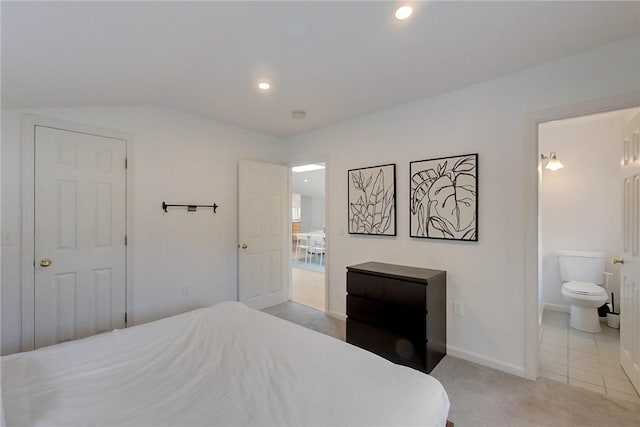 26 Cliff Ave Unit 4, Newport, RI 02840 - bedroom with vaulted ceiling, recessed lighting, baseboards, connected bathroom, and light carpet