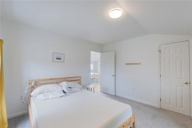 26 Cliff Ave Unit 4, Newport, RI 02840 - bedroom with light carpet, vaulted ceiling, and baseboards