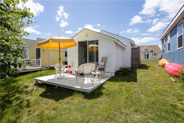 64 Burnside Ave, Narragansett, RI 02882 - back of property with a deck and a yard