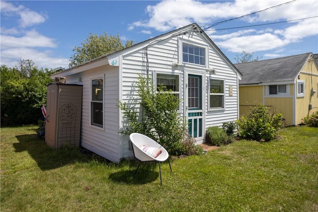 64 Burnside Ave, Narragansett, RI 02882 - view of home's exterior featuring a yard and an outbuilding