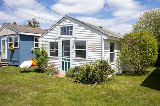 64 Burnside Ave, Narragansett, RI 02882 - rear view of house featuring a lawn