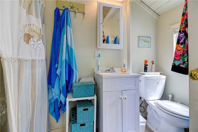64 Burnside Ave, Narragansett, RI 02882 - bathroom featuring toilet, vanity, and lofted ceiling