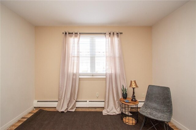 70 Carroll Ave Unit 510, Newport, RI 02840 - sitting room featuring baseboards and wood finished floors