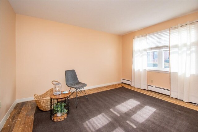 70 Carroll Ave Unit 510, Newport, RI 02840 - unfurnished room with wood finished floors, baseboards, and a baseboard radiator