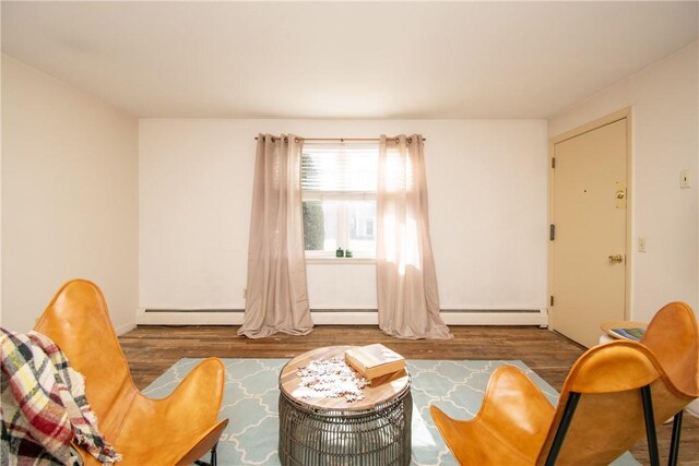70 Carroll Ave Unit 510, Newport, RI 02840 - sitting room featuring wood finished floors, baseboards, and a baseboard radiator