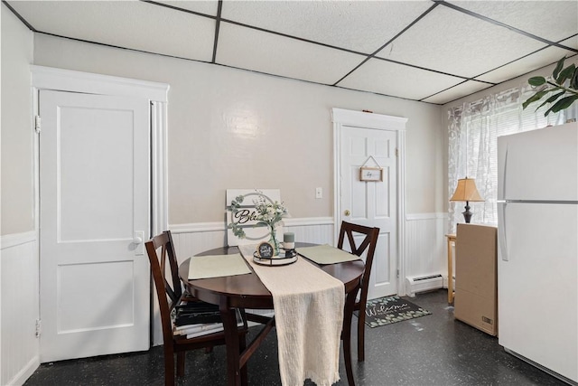 23 Auburn St, Pawtucket, RI 02860 - dining space featuring wainscoting, a drop ceiling, baseboard heating, and a decorative wall